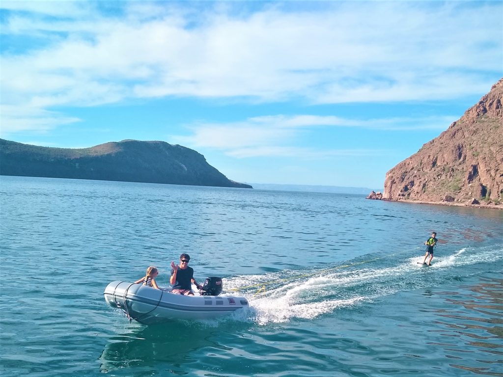 Nathan's first wake boarding behind the dinghy