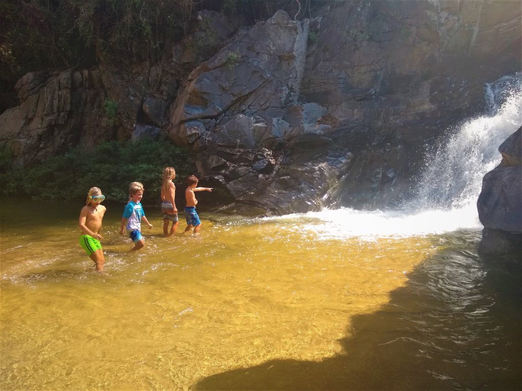 Kids enjoying the waterfall after a long hike in Yelapa