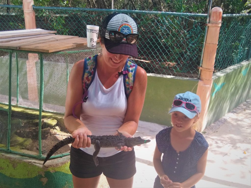 Holding Baby Crocodiles at the crocodile sanctuary in La Manzanilla
