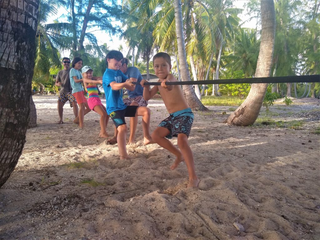 Tug-o-war on the beach at the birthday party for the boat kids.