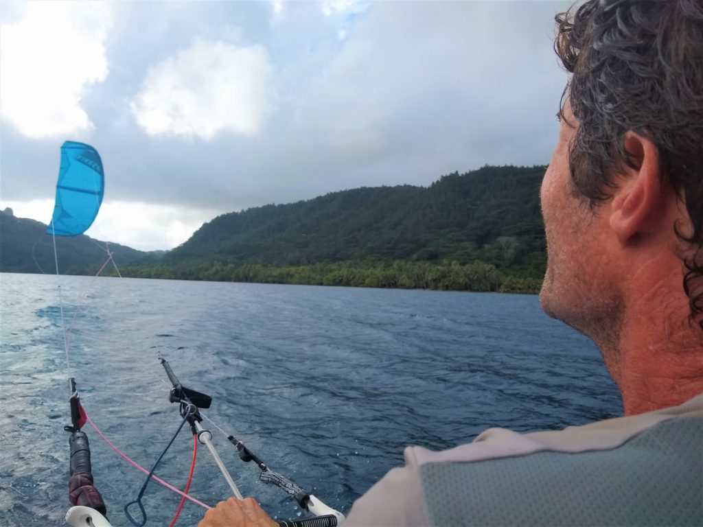 Gavin concentrating on flying the kite from our dinghy as we motor upwind. Our kiting maneuvering off the boats is getting better and better!