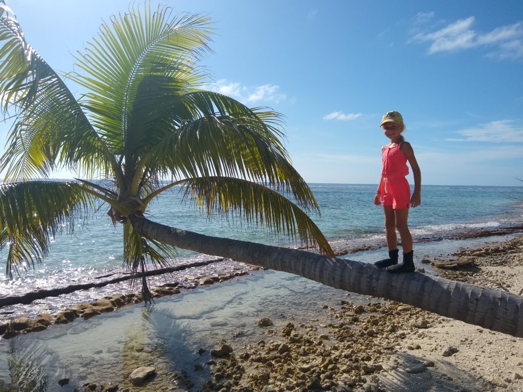 Julia balancing on a morning beach walk.