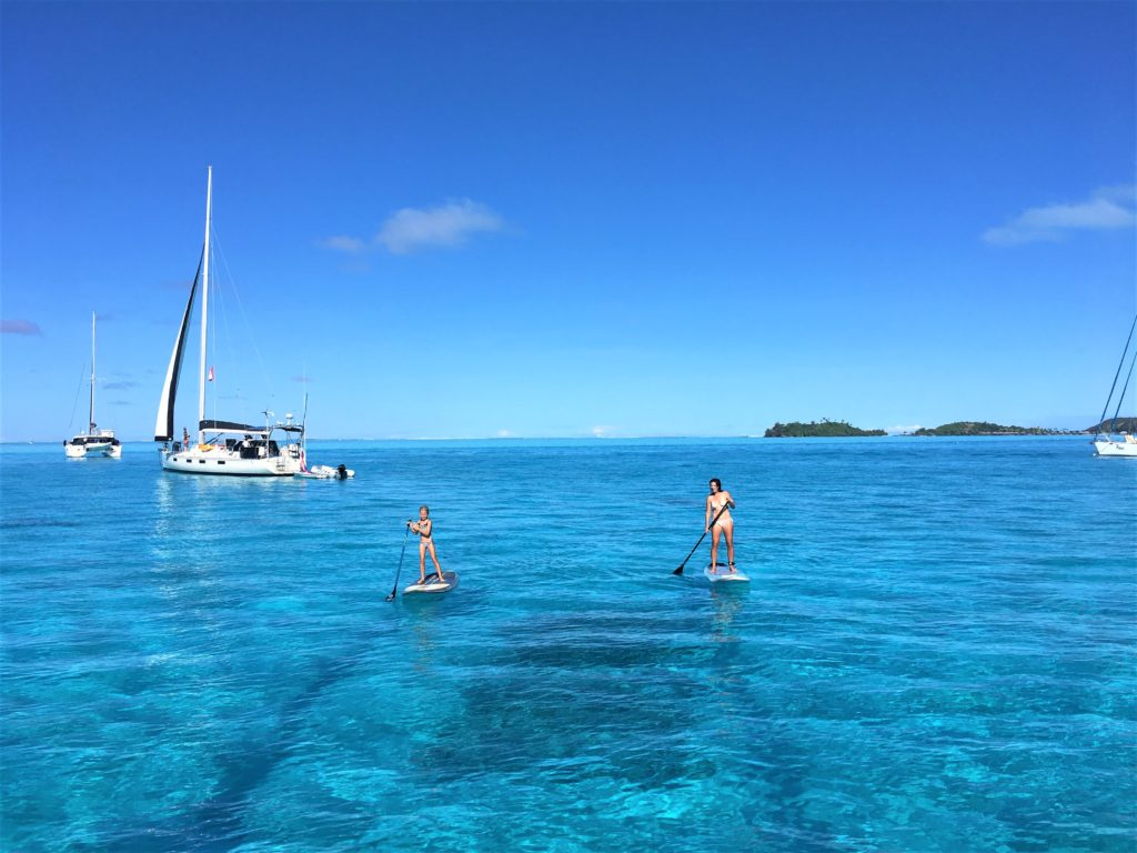 Morning paddle in Bora Bora (thank you SV Flocerfida for the photo!) with Julia