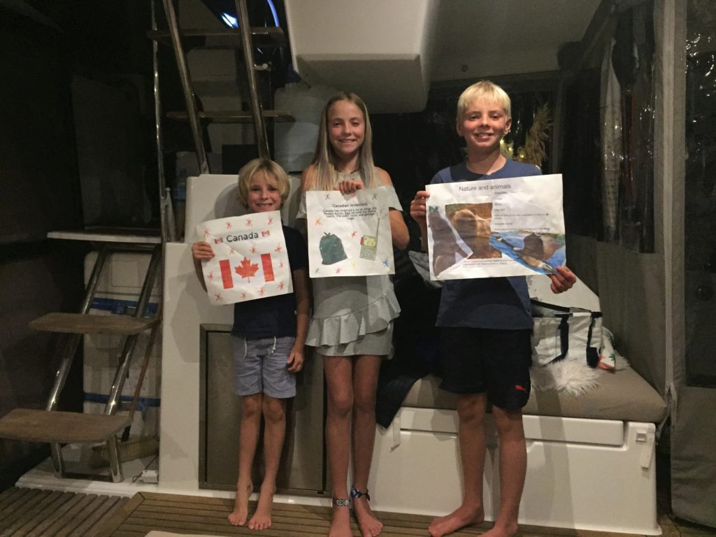 Queen kids giving a presentation about Canada