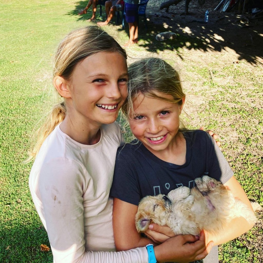Happy gals with adorable 'Popo' - this puppy was very well loved while we were visiting!