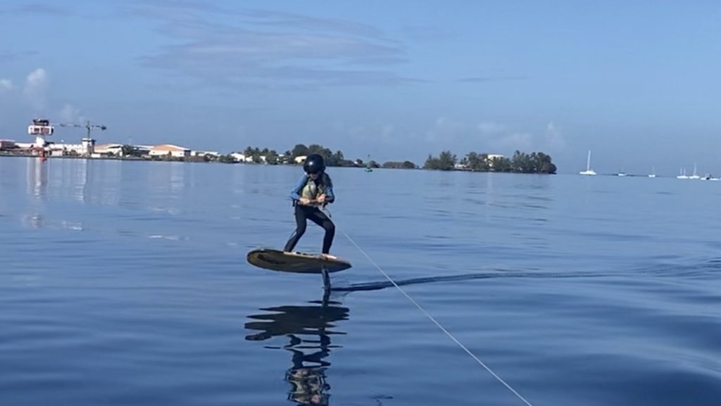 Julia Tow-foiling in Tahiti